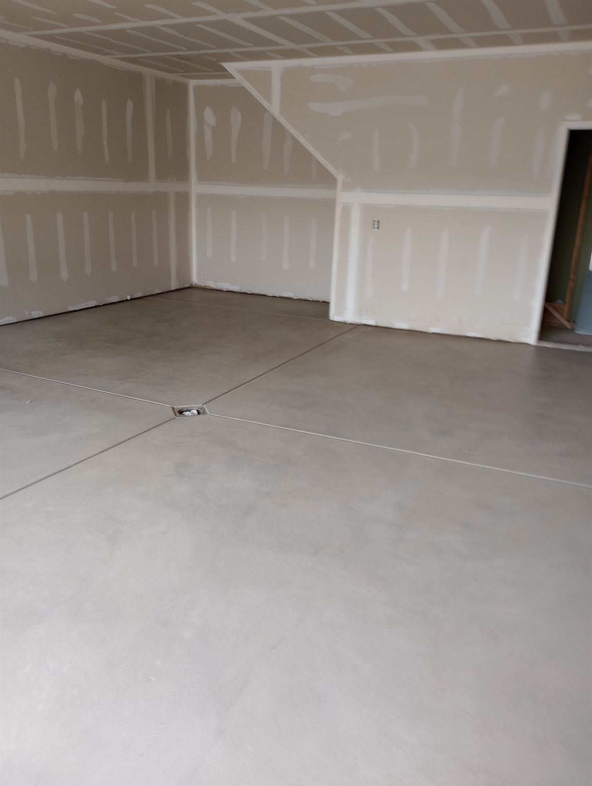 Interior remodel by A-1 Solid — fresh drywall and a new poured floor